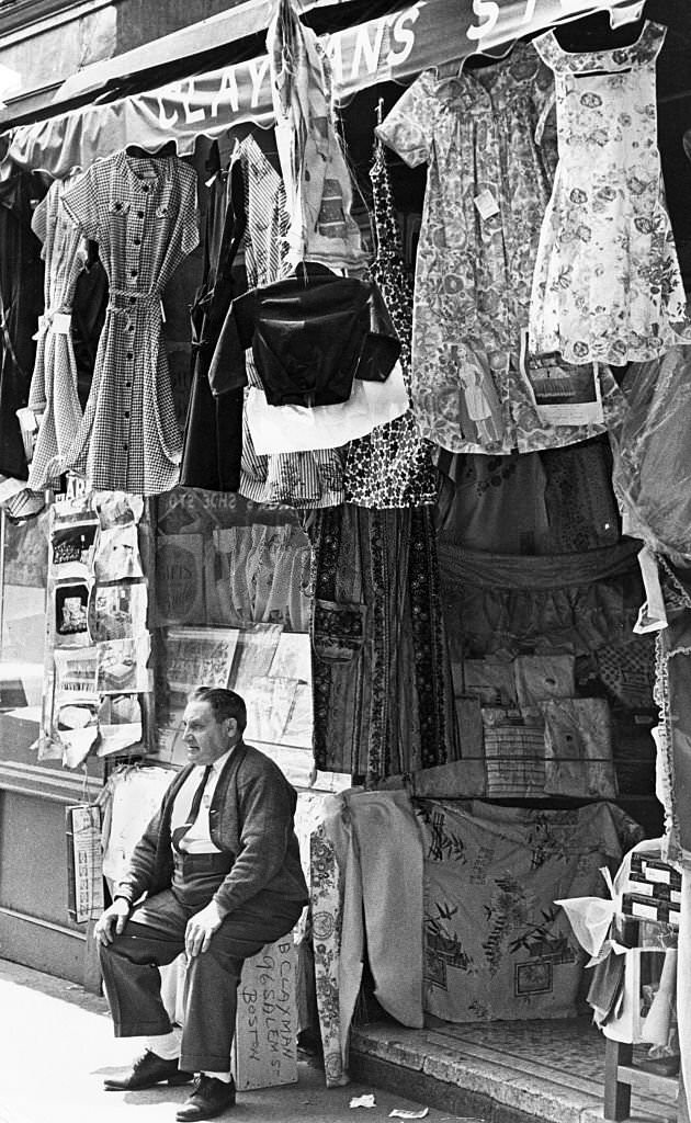 Benjamin Clayman sits outside his 45-year-old dry goods store at 96 Salem St. in Boston's North End on May 21, 1963.