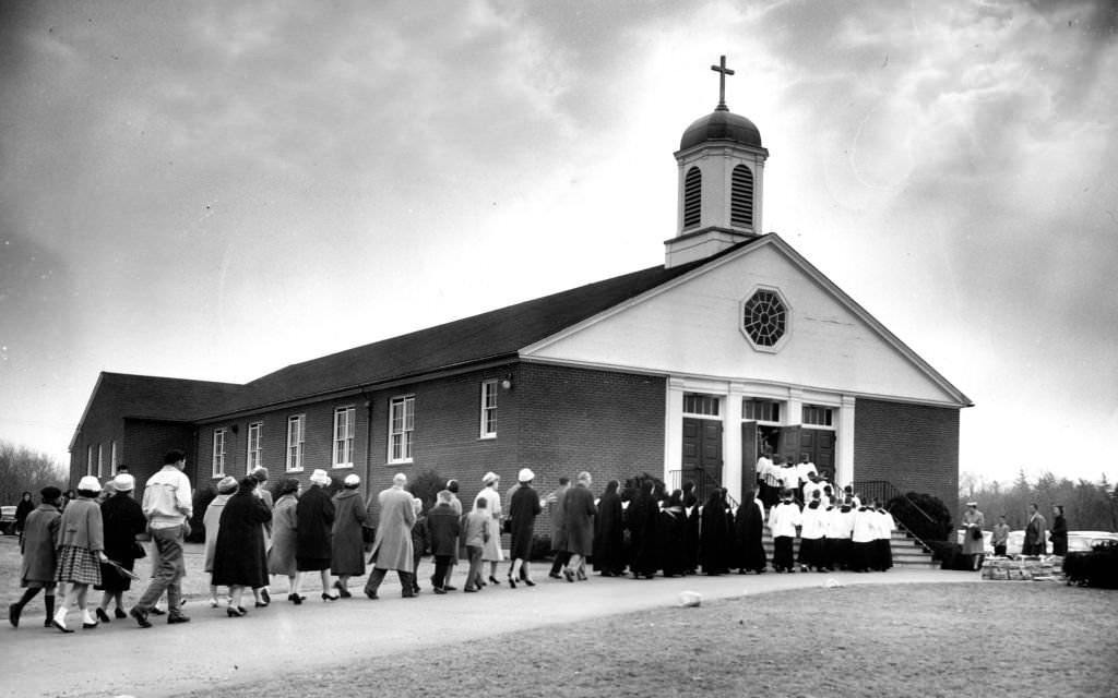 A Palm Sunday processional enters St. Pius X Church in the Hyde Park neighborhood of Boston on April 7, 1963.