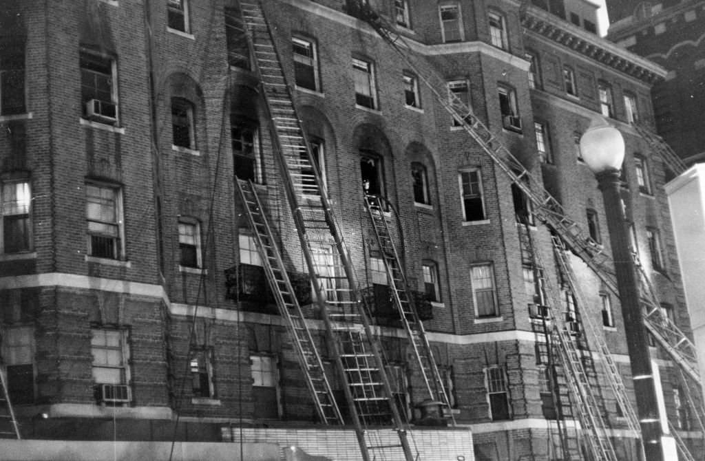 Ladders lean on the side of the Sherry Biltmore Hotel after a five-alarm fire in Boston, March 29, 1963.