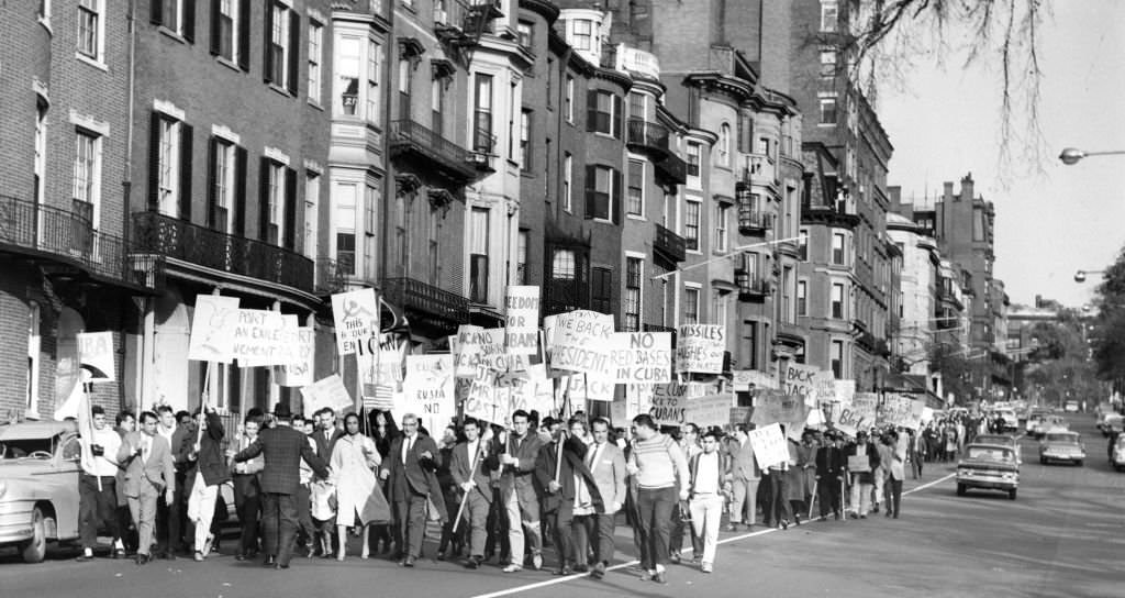 Cuban refugees and their supporters march down Beacon Street in Boston during a demonstration to display their support of the U.S. government in the crisis in Cuba on Oct. 28, 1962.