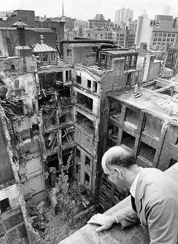 Al Debonise views what remains of the old Boston Globe building on Washington Street in Boston from a neighboring rooftop, April 1967.