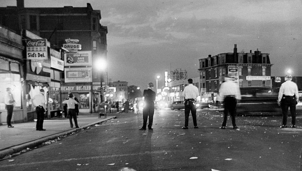 Police stand in the street during a riot in the Roxbury neighborhood of Boston on June 1, 1967.