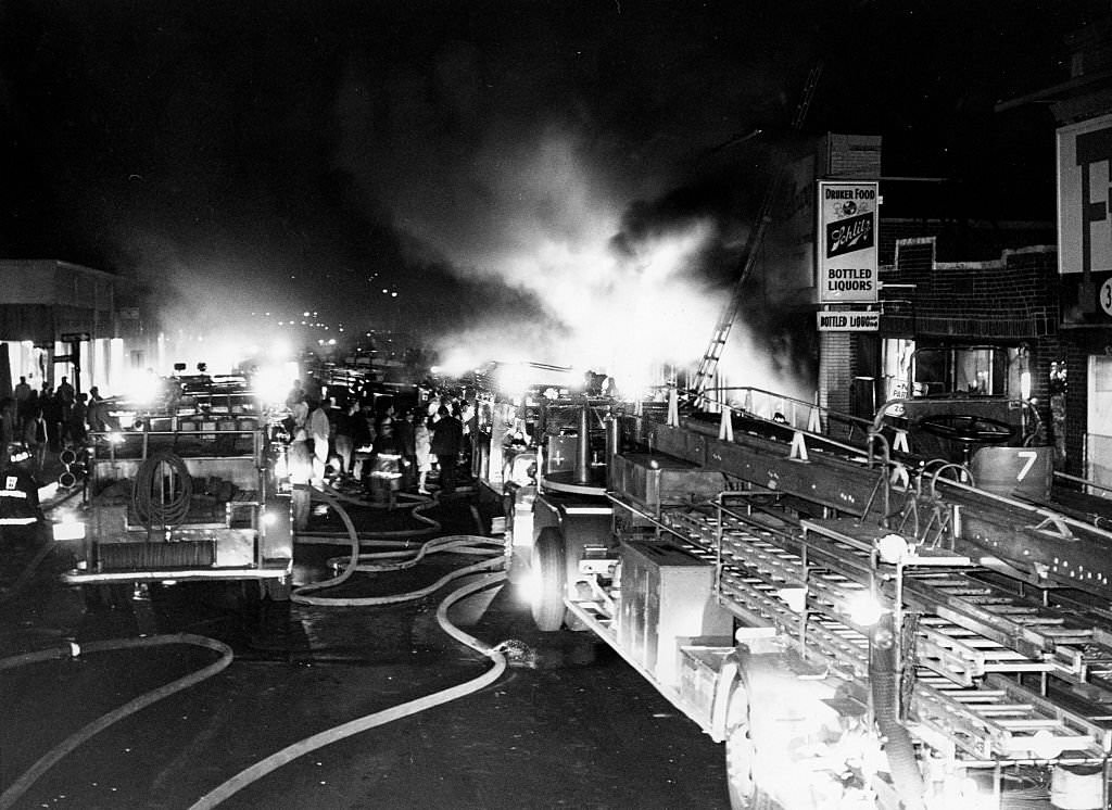 A three-alarm fire burns in a paint store on Blue Hill Avenue in the Roxbury neighborhood in Boston on June 3, 1967.