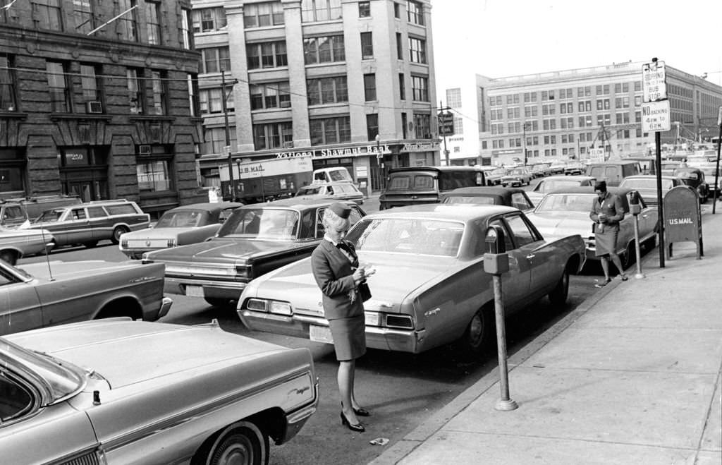 Meter maids Carol DeMarinis, left, and Kathleen Moccia make their rounds in Boston on Oct. 19, 1967.