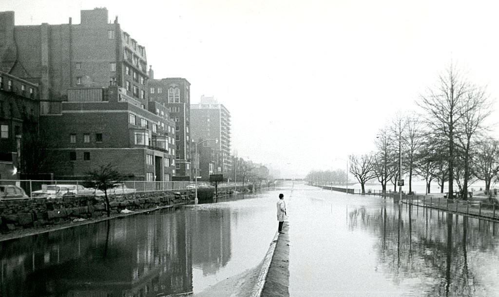 This man has no good choices for crossing the street on March 19, 1968, as a surprise spring deluge causes major flooding throughout eastern Massachusetts.