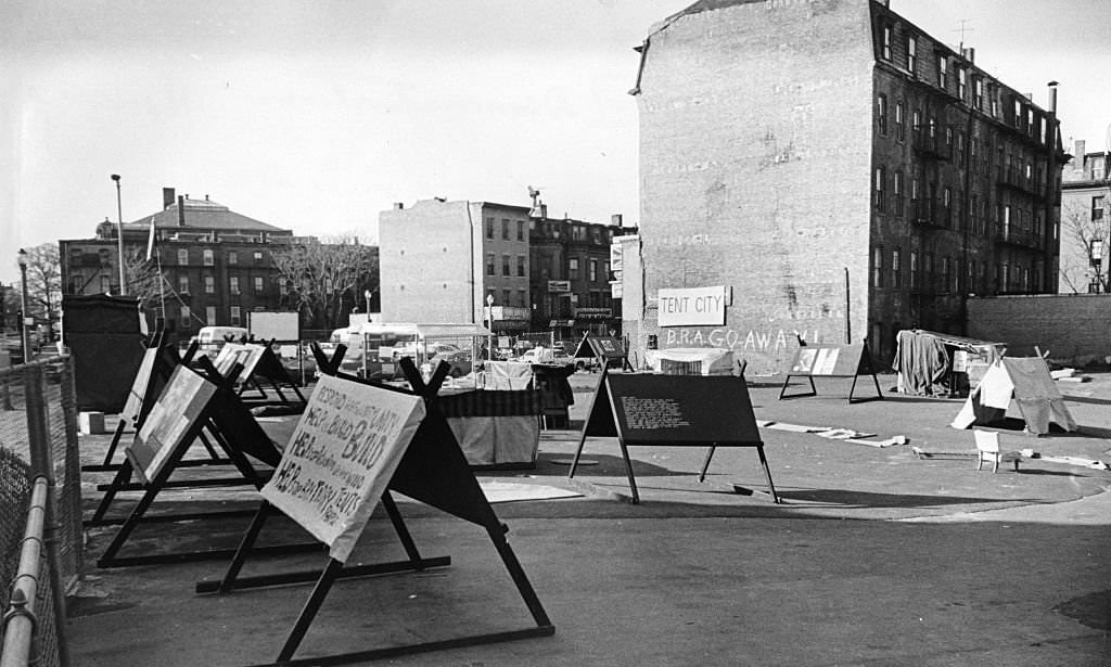 Anti-urban renewal protesters set up a "tent city" camp with signs in a parking lot in the South End of Boston, April 1968.