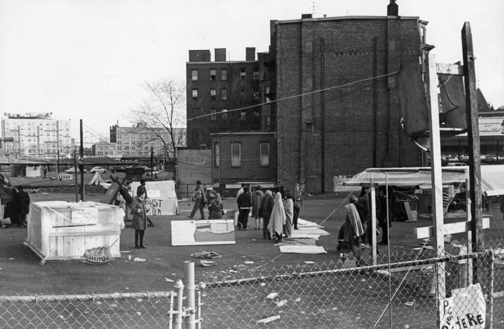 Anti-urban renewal protesters pitch tents and hold signs in a Dartmouth Street parking lot in the South End of Boston, April 1968.