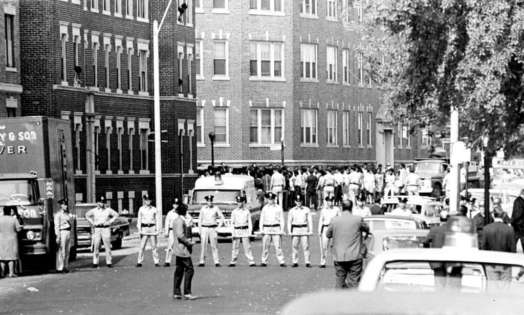 Boston Police officers line up on Washington Street in the Dorchester neighborhood of Boston on Sep. 25, 1968 during a disturbance near the Jeremiah Burke High School.