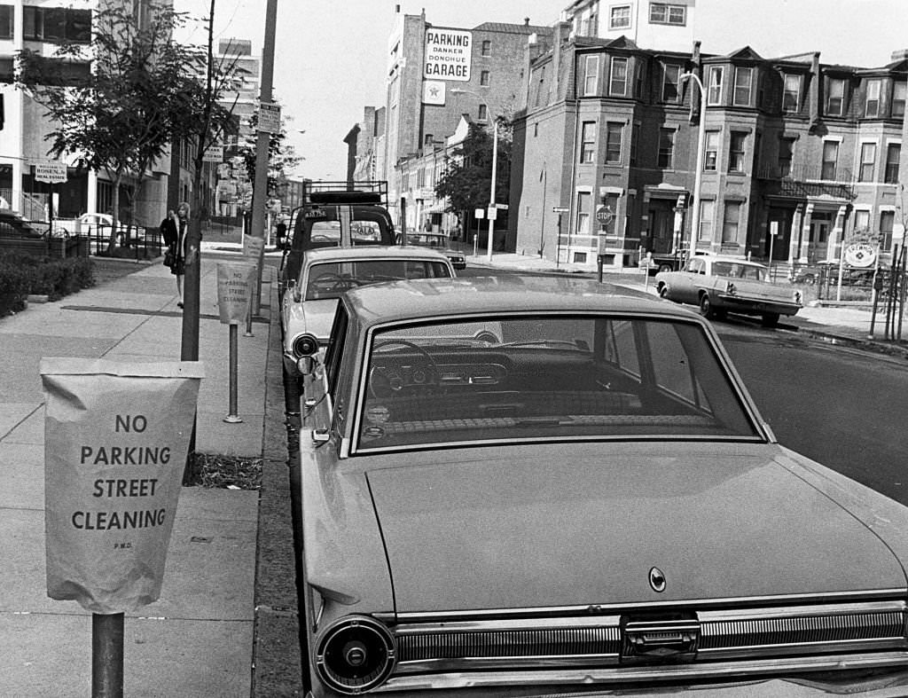 Cars block Newbury Street in Boston's Back Bay from being cleaned on Oct. 3, 1968.