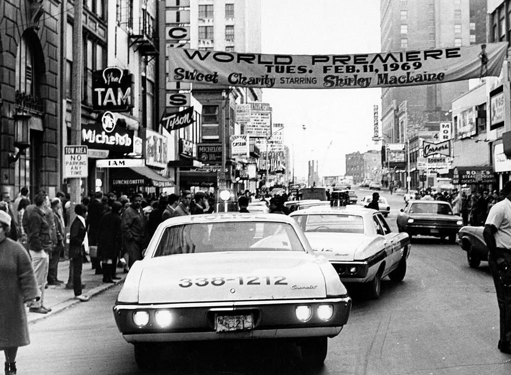 Police and bystanders gather outside of Tam Cafe at 222 Tremont St. in Boston after a shooting on March 17, 1969.