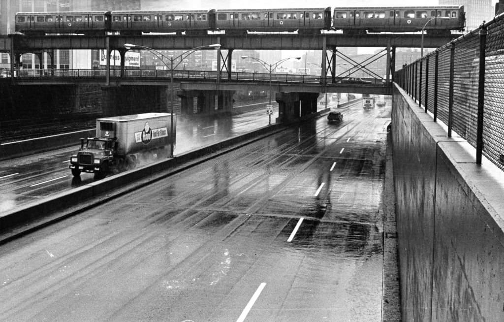 An elevated MBTA train runs never the Mass. Pike and the Washington Street in Boston on March 25, 1969.