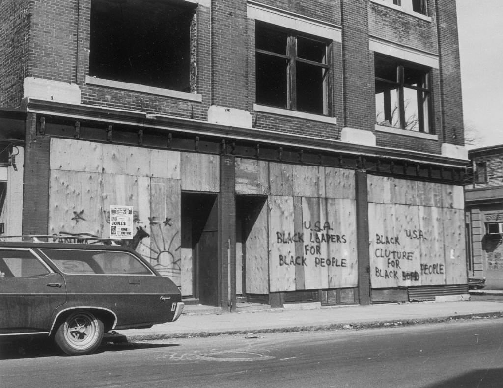Graffiti reading U.S.A.: Black leaders for Black people, Black culture for Black people, on boarded up buildings along Blue Hill Avenue in Boston on May 4, 1969.