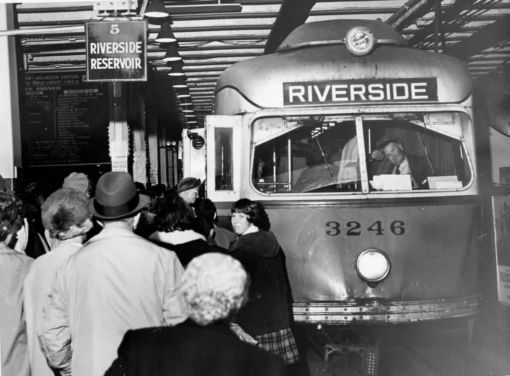 Riders of the MTA's Highland Branch line crowd aboard a car at Park Street Station in Boston on Oct. 28, 1961.