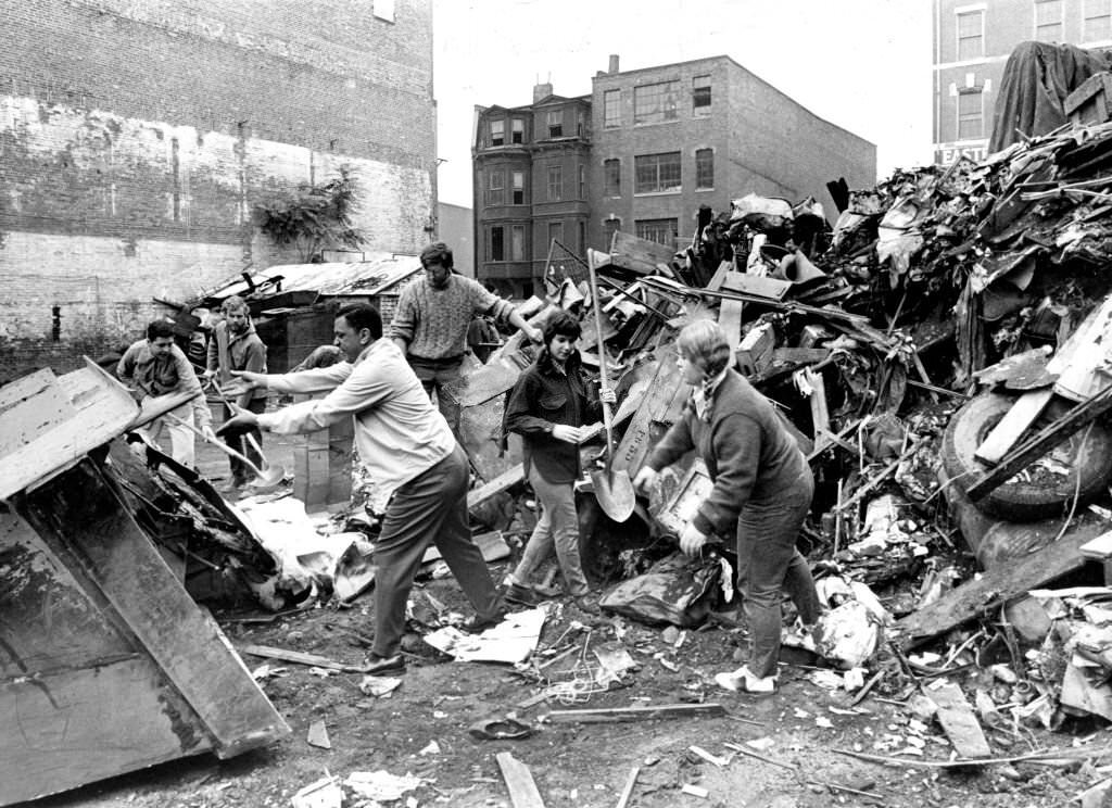 A group of volunteers from local community youth agencies work to clean up a vacant lot at 114 West Brookline St. in Boston's South End on Oct. 11, 1969.