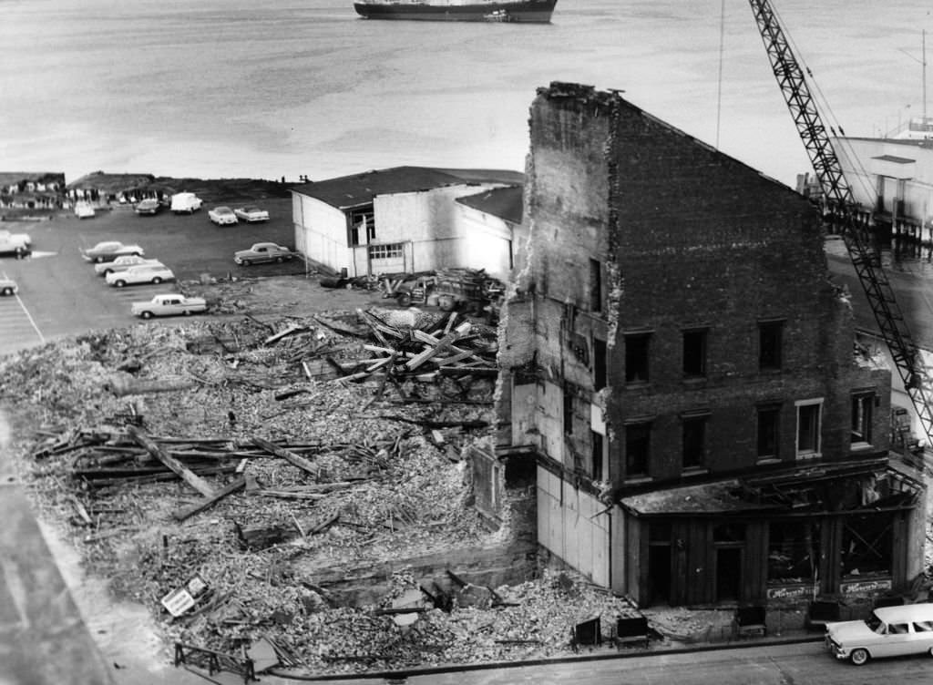 A building is torn down on the India Wharf in Boston, July 1962.