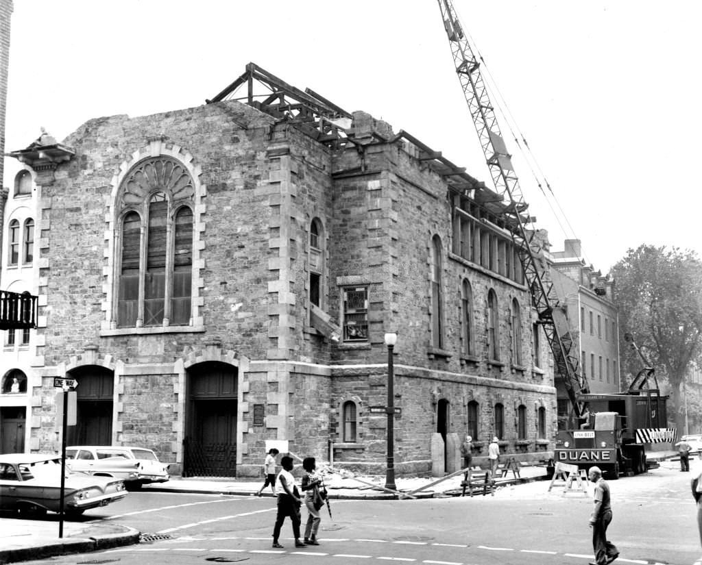 Workmen raze the upper portion of Our Lady of Cedars of Lebanon Church on Shawmut Avenue in Boston's South End after it wads condemned by building inspectors on Aug. 29, 1961.