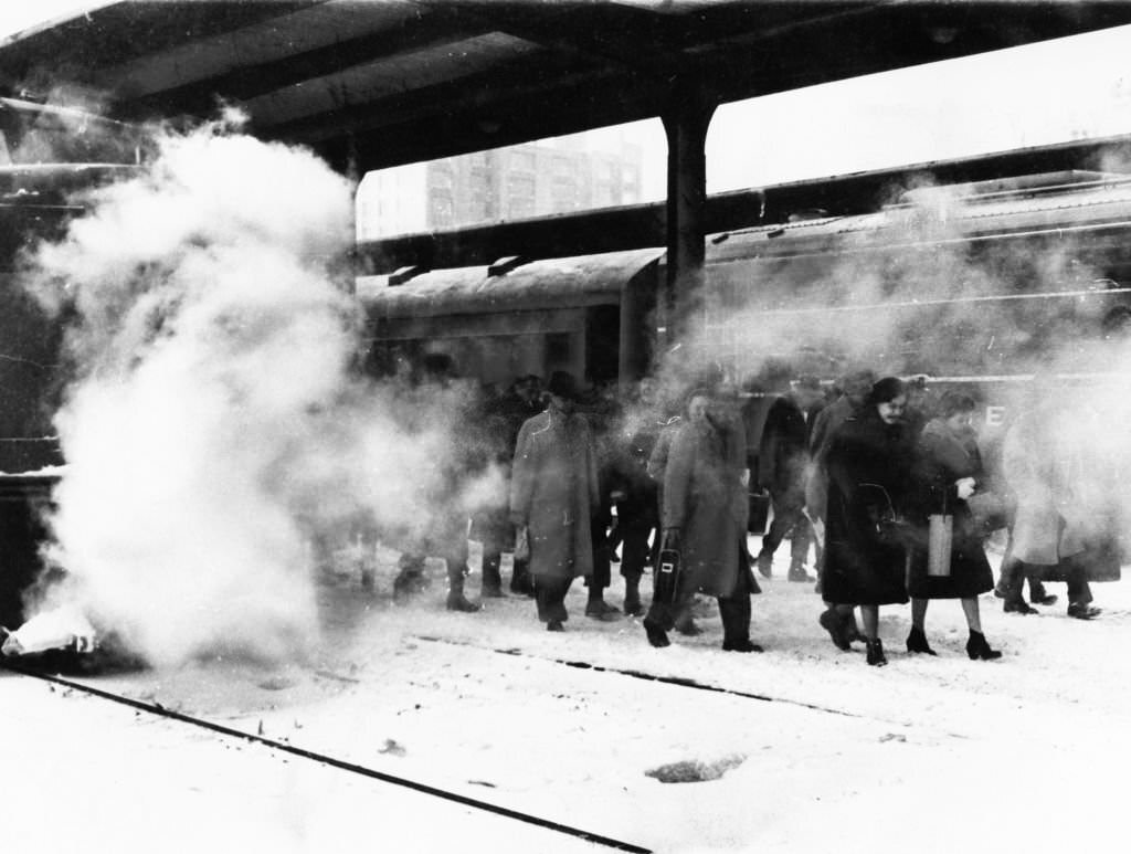 People on a train from Needham arrive at South Station in Boston on Dec. 13, 1960.