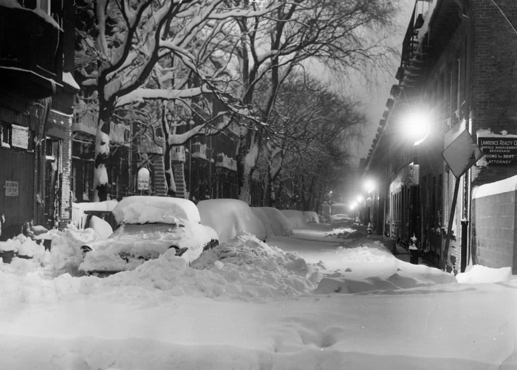 Snow covers a street in the South End of Boston on March 3, 1960.