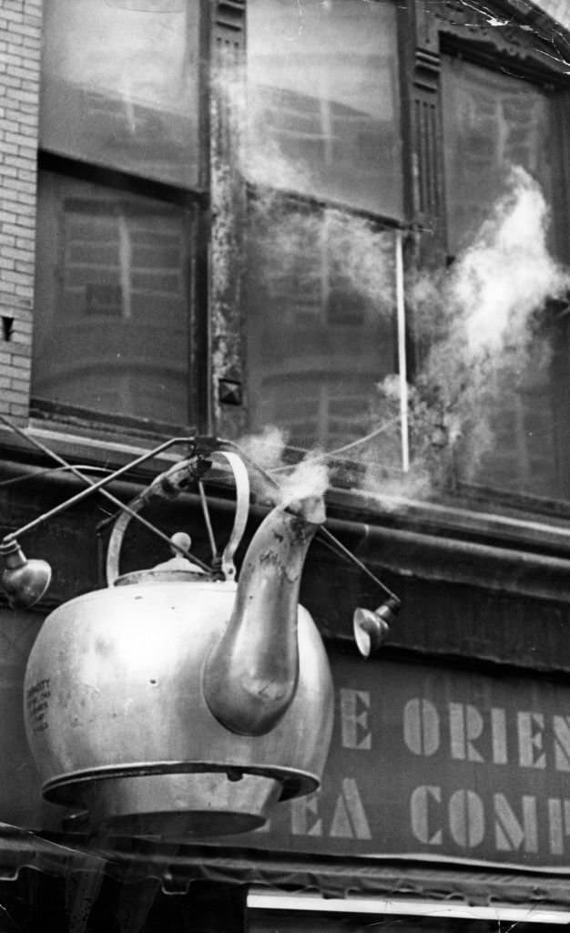 Active steam rises from the teapot signpost for the Oriental Tea Co. in Boston in the 1960s.