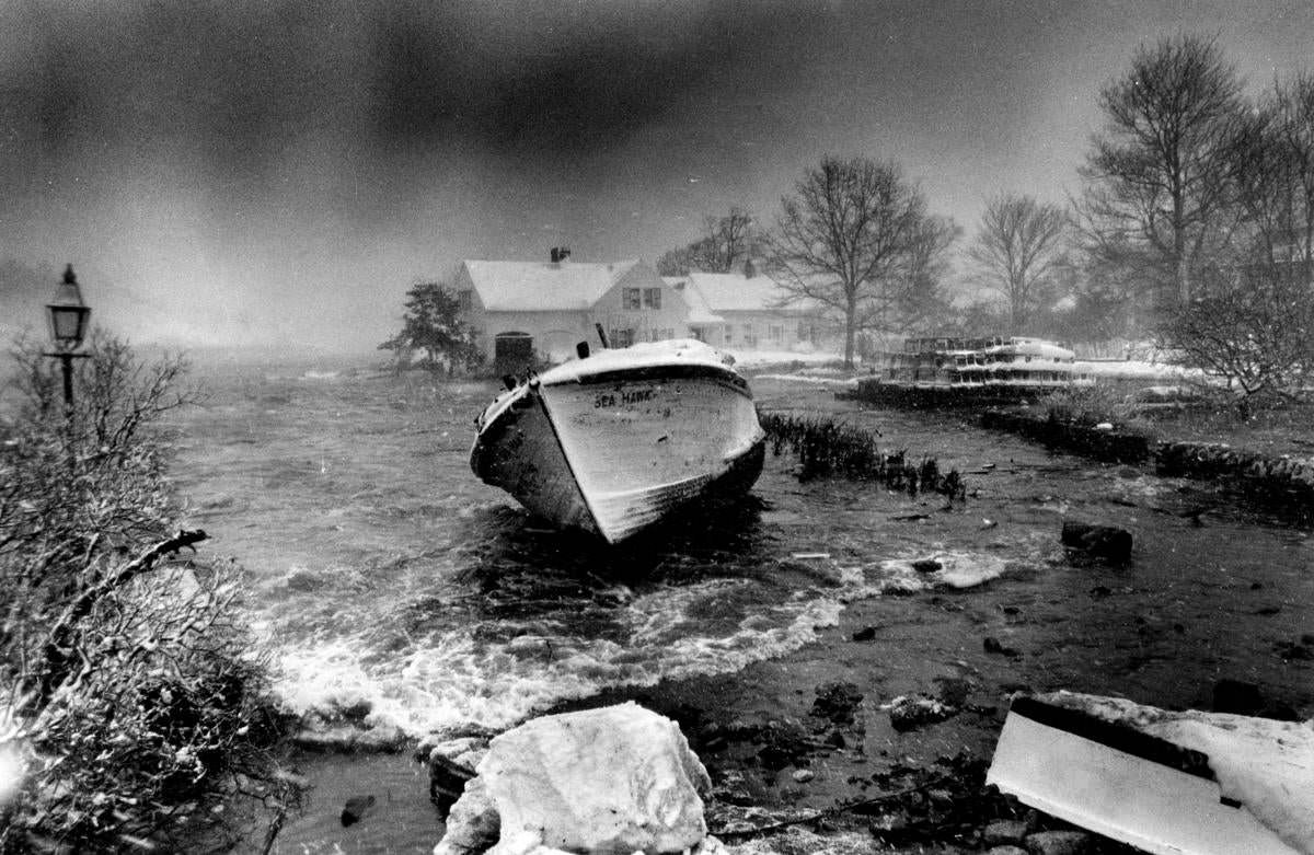 A boat was washed up in Doliber’s Cove in Marblehead, where water came up to homes during high tide.