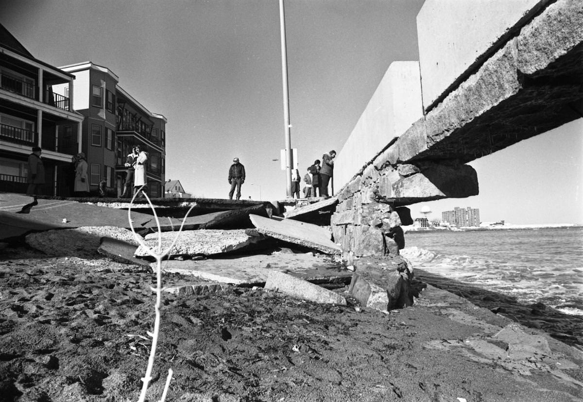 Residents looked at the section of the broken sea wall along Winthrop Shore Drive in Winthrop after the storm.