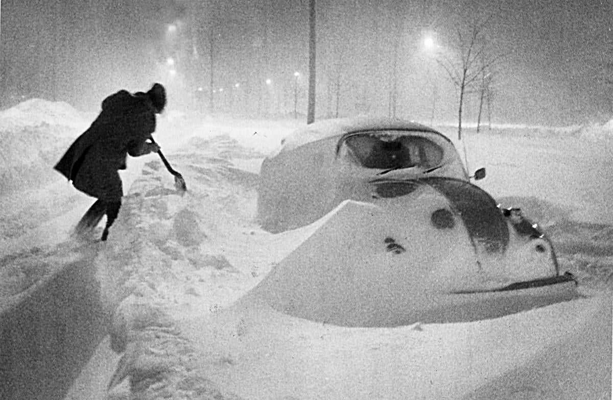 Falling and drifting snow surrounded a car on Morrissey Boulevard during early morning hours of the blizzard on Feb. 7.