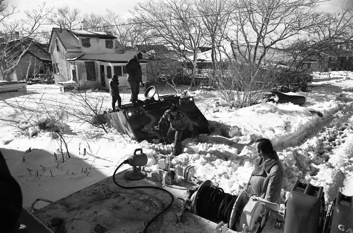 Army personnel from Fort Devens were stuck in five feet of slush trying to rescue the couple in Revere.