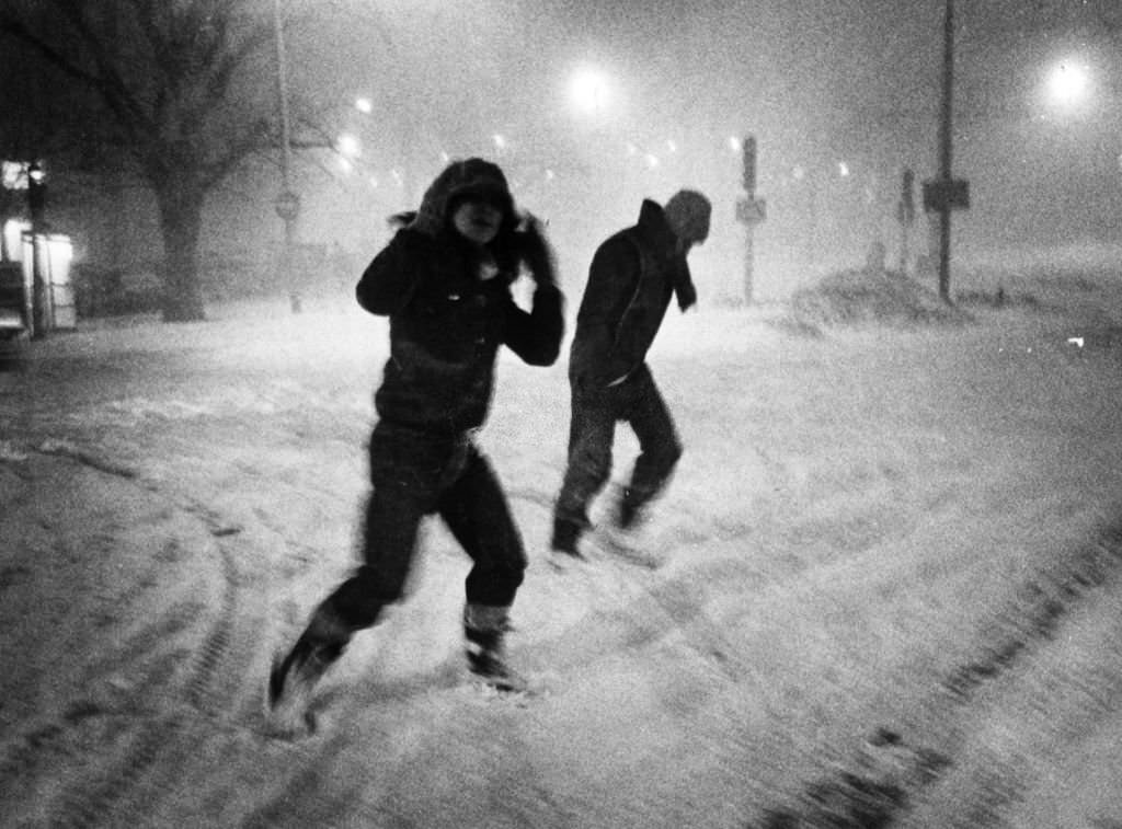 Pedestrians brave the wind and snow of the Blizzard of 78 while crossing Commonwealth Avenue in Boston on Feb. 6, 1978.