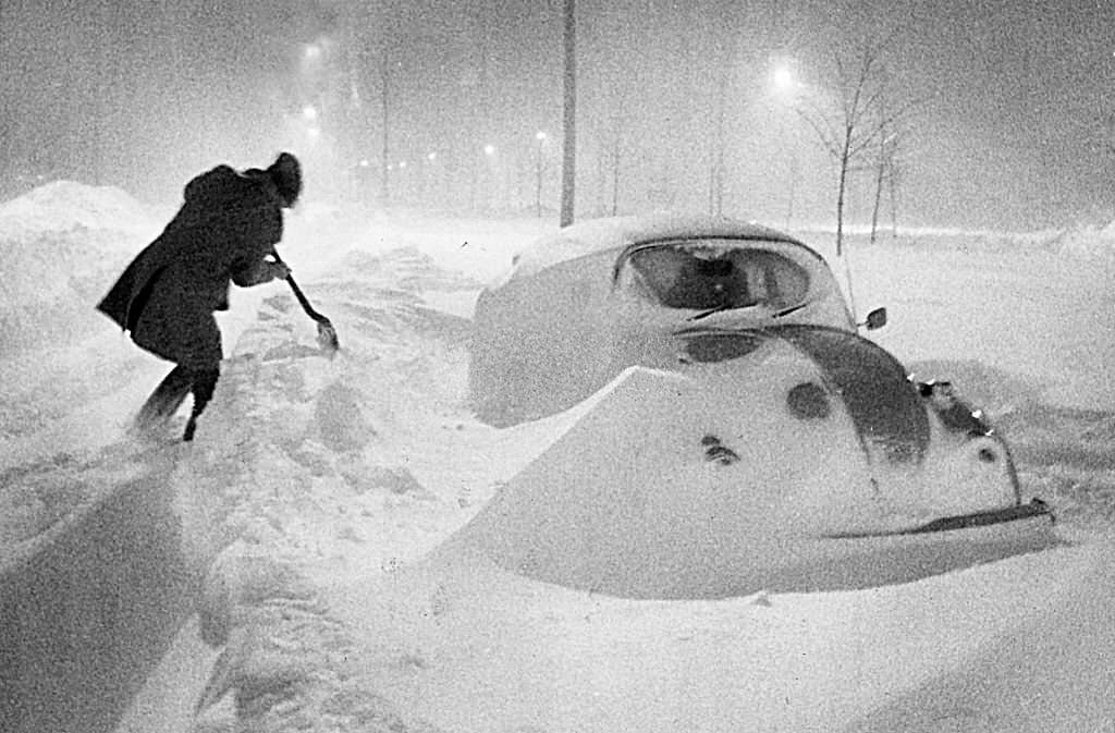 Falling and drifting snow surrounds a car on Morrissey Boulevard during the early morning hours of Feb. 7, 1978.