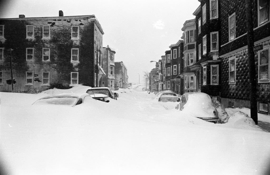 Cars are covered by snow drifts on Washburn Street in Boston on Feb. 7, 1978.