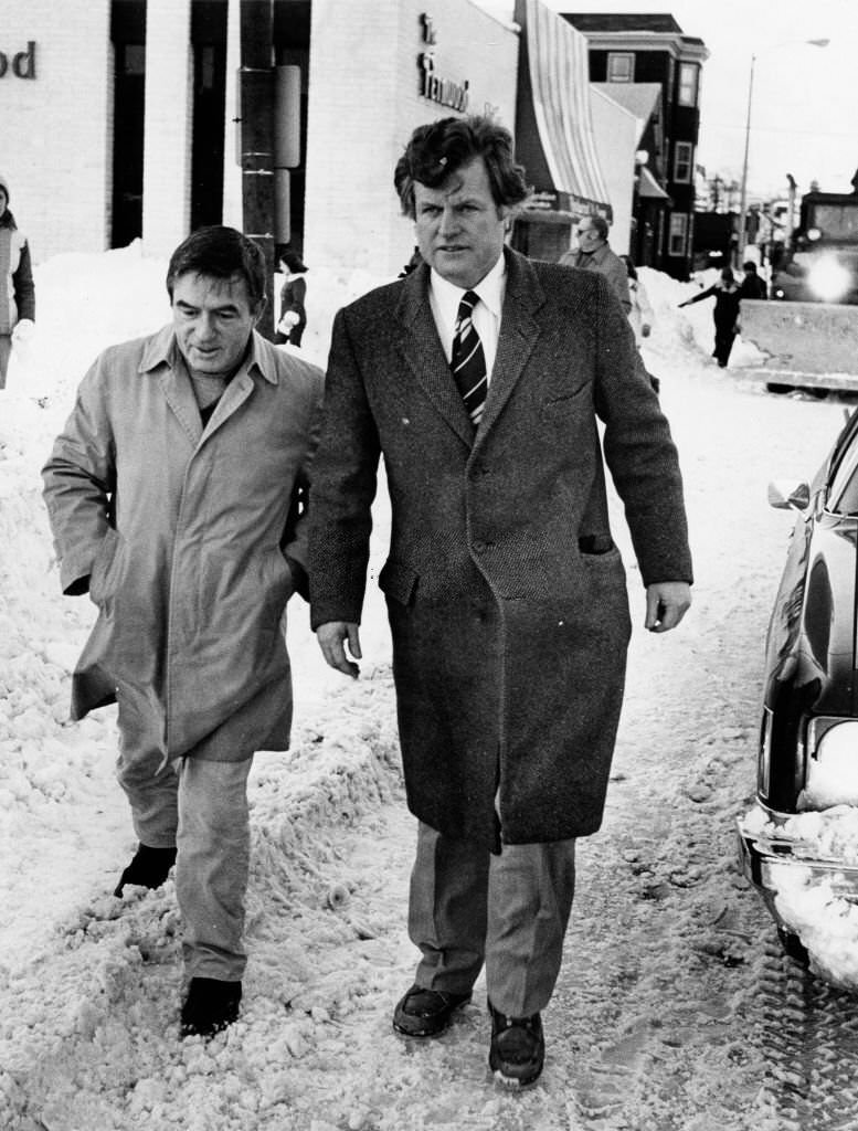 Senator Edward M. Kennedy and an aid, Edward Martin, walk down Broadway after a blizzard in Boston on Feb. 8, 1978.