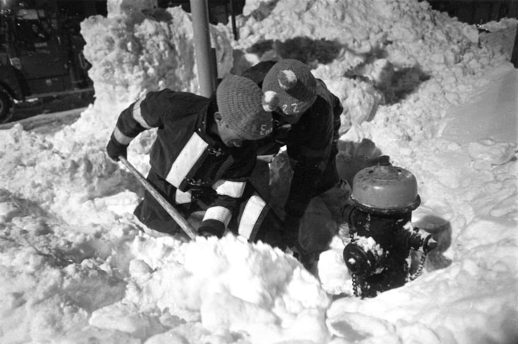 Firefighters Pat Moni and Dick Laureana of Engine 22 dig out a hydrant on Massachusetts Avenue in Boston following the "Blizzard of 78".