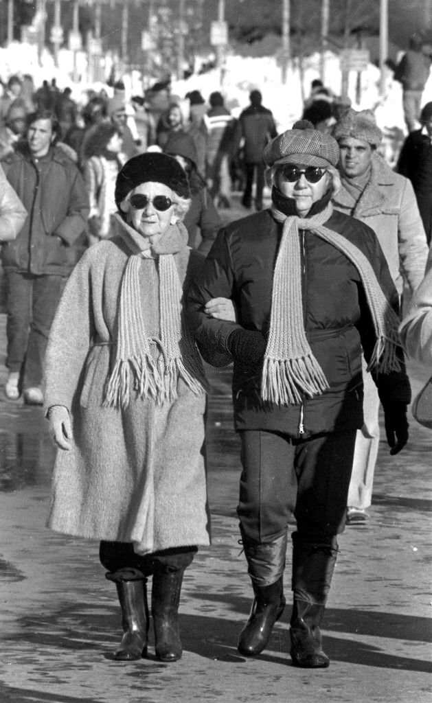 Mrs. Howard Kirk and her daughter, Jane, residents of Boston's Back Bay, join hundreds of others strolling on Boylston Street days after the "Blizzard of 78".