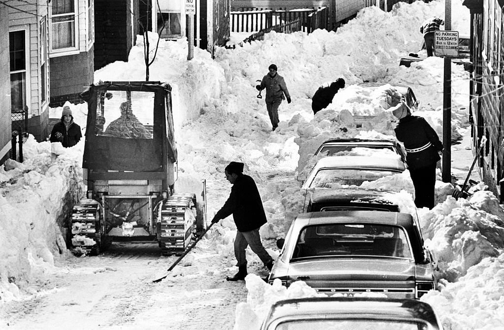 People shovel out Pleasant Street in Boston's Charlestown area around noon on Feb. 12, 1978.