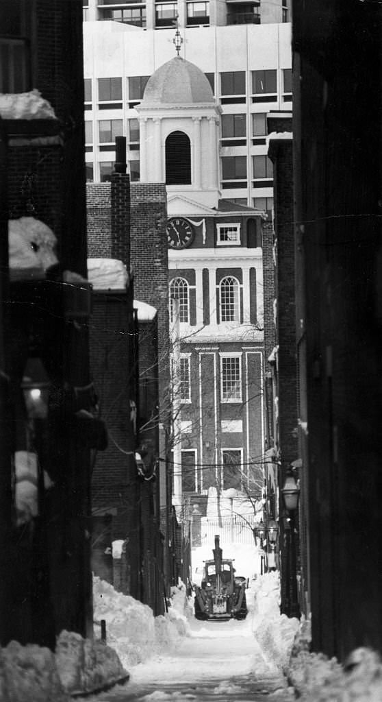 A plow clears snow from Ridgeway Lane in front of the Old West Church in Boston's Beacon Hill on Feb. 14, 1978.