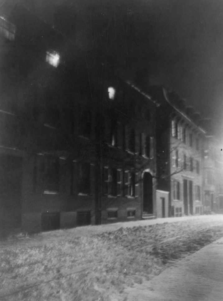Blurred night view down snowy Pinckney Street, townhouses along left, Boston, Massachusetts, 1906.