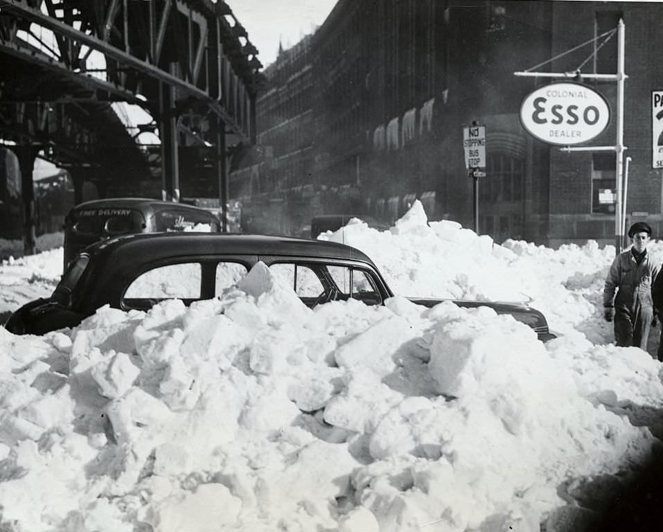 Car buried in huge drifts of snow in Boston's business section, the result of New England's worst blizzard in years.