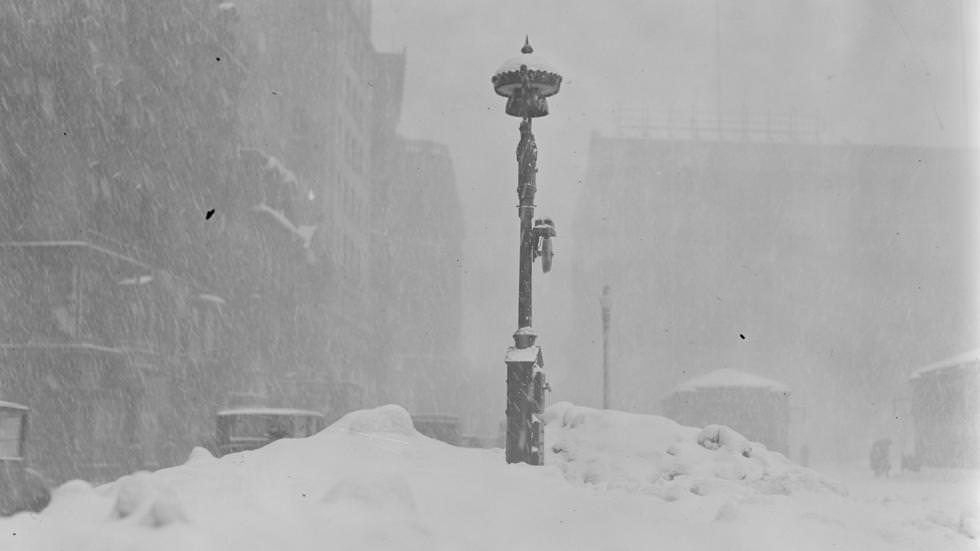 Fire alarm box almost covered up by snow after severe snowstorm, 1923