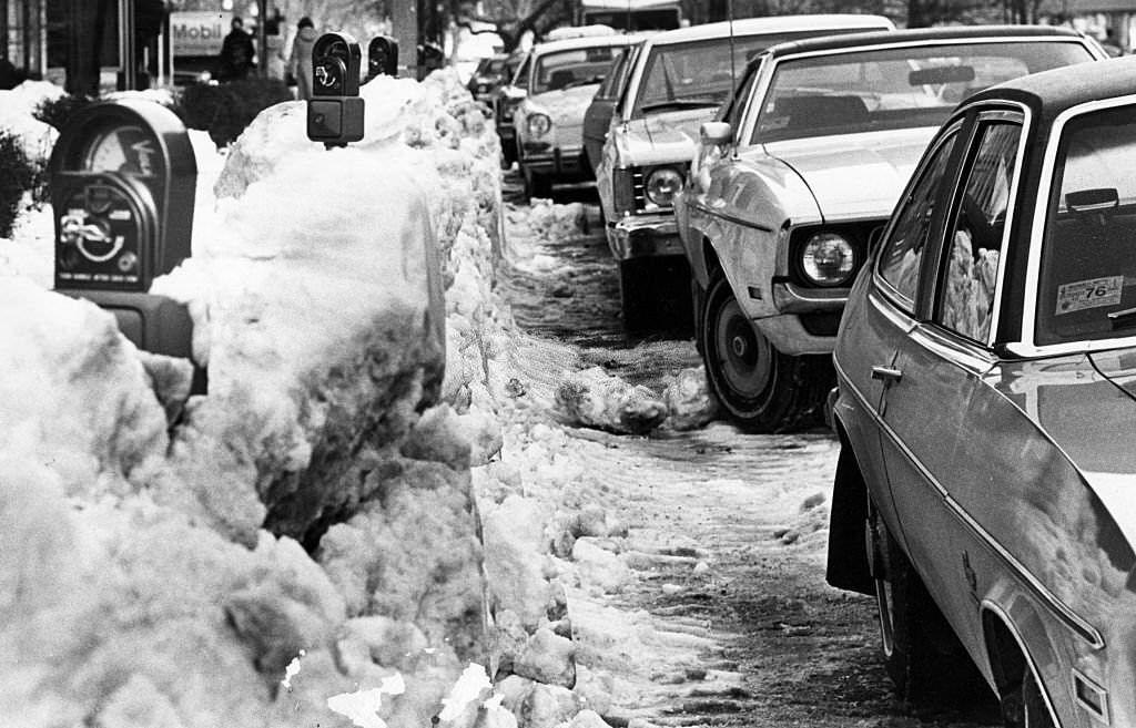Parking and parking meters are hard to find along a snow-covered Newbury Street in Boston, 1977.
