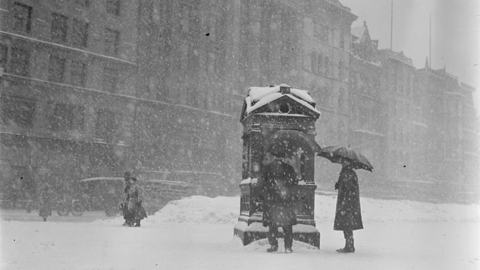 People looking at the weather instruments on Common in snow, 1923