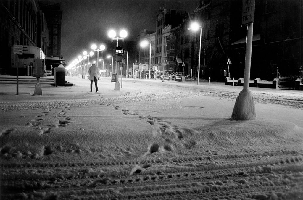Footsteps in Copley Square as a 5 a.m. commuter scurries.