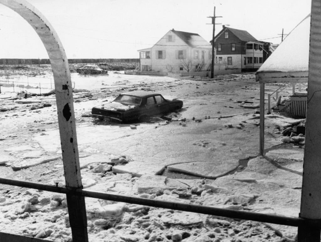 Broad Sound Avenue by Revere Beach is flooded with snow and ice after a winter storm, 1972.