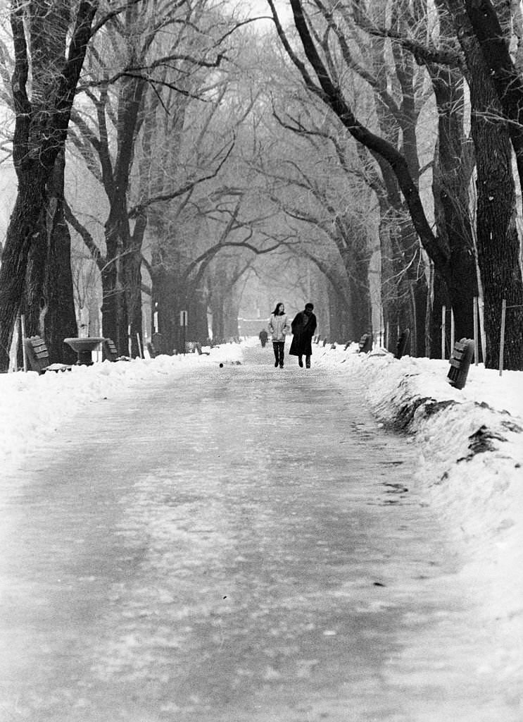 Two pedestrians walk through the Commonwealth Avenue Mall in Boston, 1971.