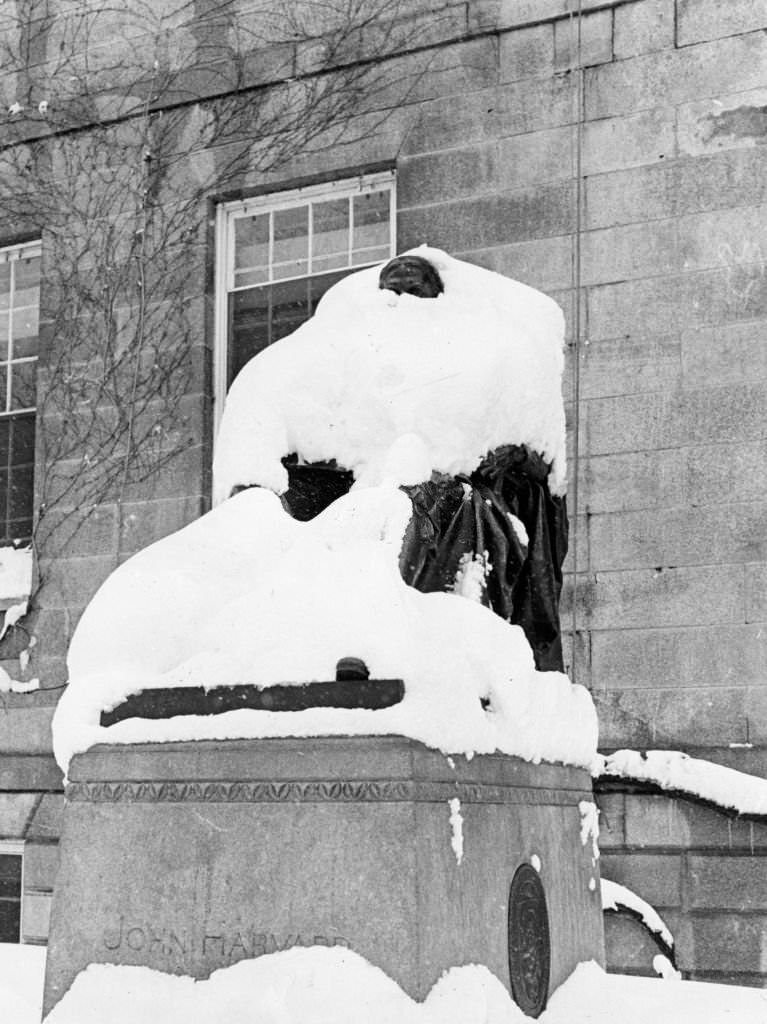 A snow covered John Harvard statue in Harvard Yard at Harvard University in Cambridge, 1969.