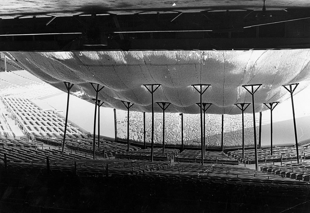 Snow accumulates on the net over the seats behind home plate at Fenway Park in Boston on Feb. 11, 1969.