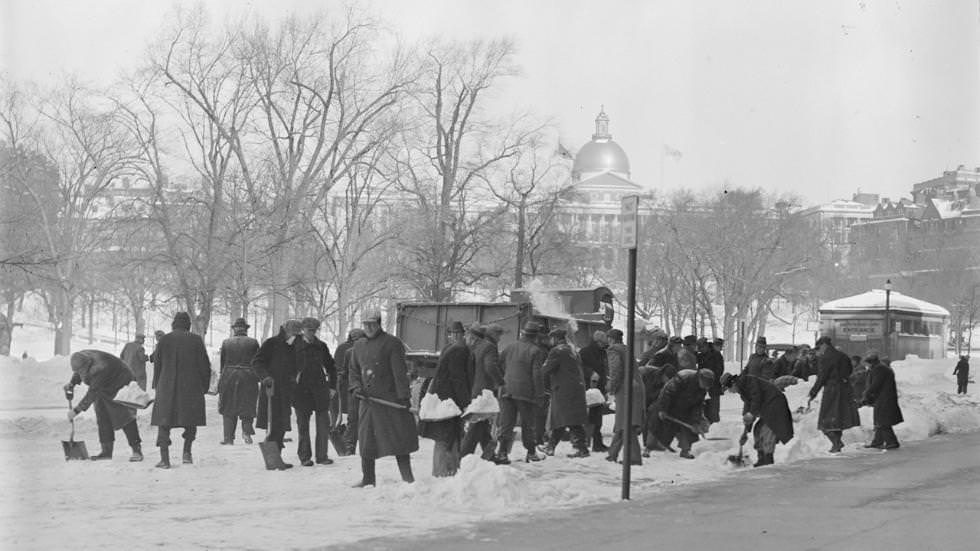 Crew shovels snow from Tremont St. near State House, 1933