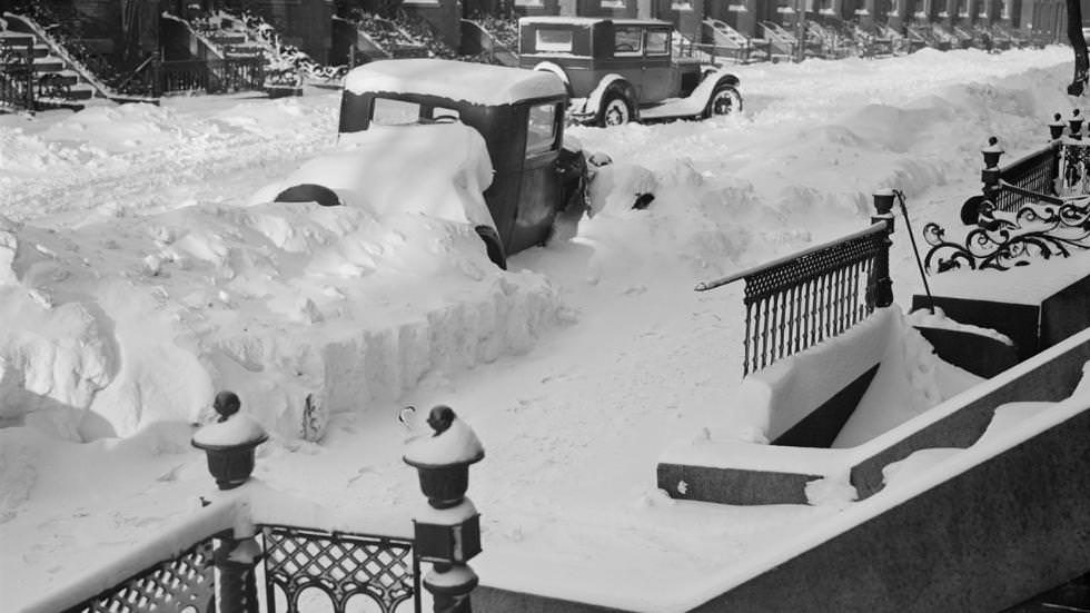Snow-covered automobiles on Boston streets, 1934