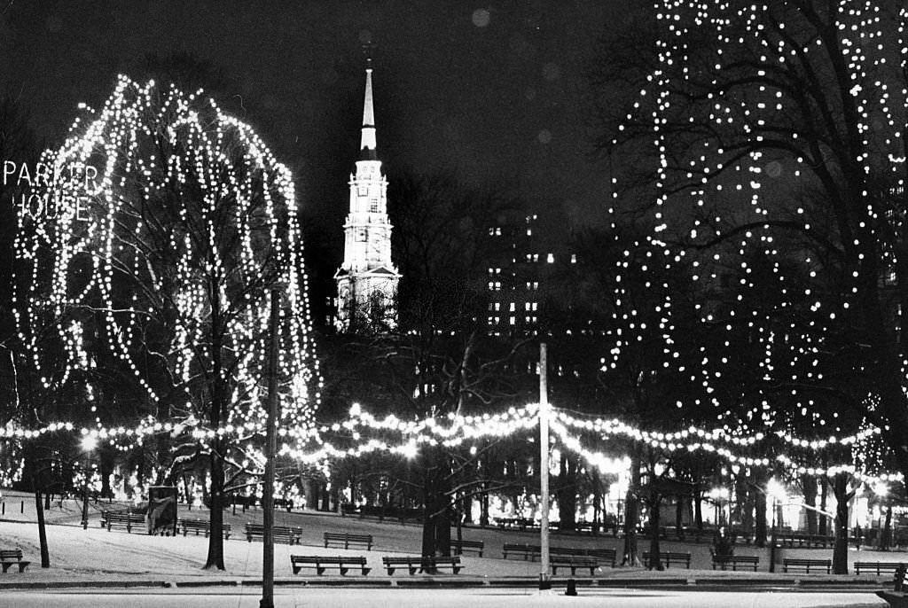 The Boston Common Frog Pond is covered in snow and lights, January 1967.