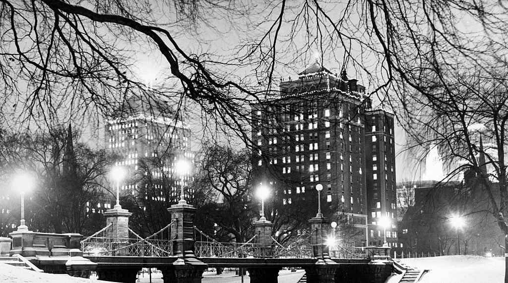 Snow covers the Public Garden in Boston at night,1966.