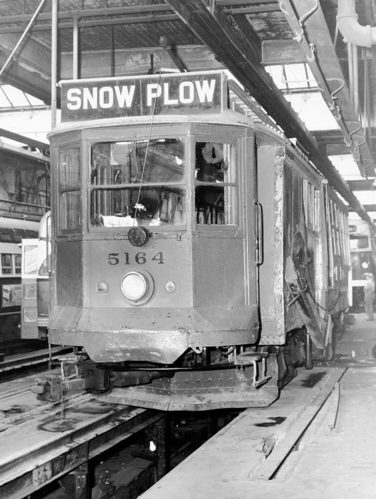 A snow plow car gets ready to go along the tracks on Nov. 23, 1964.